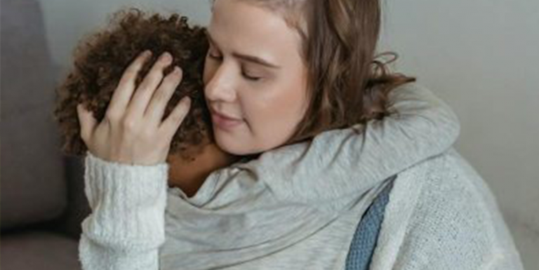 A mother hugging a child. Feature image of Rebuilding your life with your children after escaping a dangerous partner.